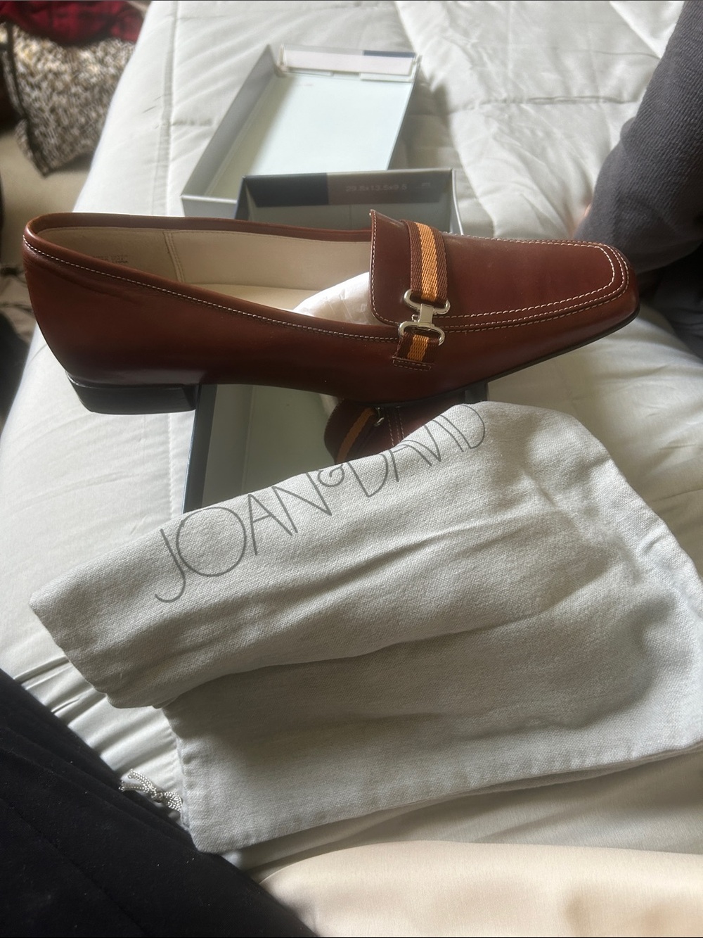 Joan & David Chestnut Brown Leather Loafers with Striped Webbing has a callout o
